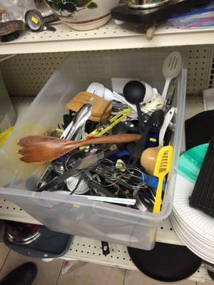 One of two big plastic bins full of kitchen items.