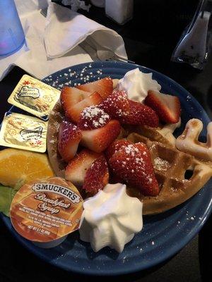 1 waffle with whipped cream and strawberries