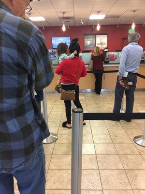 Three tellers and 7 people in line.