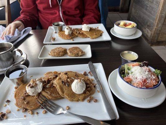 Carrot cake pancakes with vegan cream cheese. Side salad, side of fruit, chicken sausage. All excellent!!