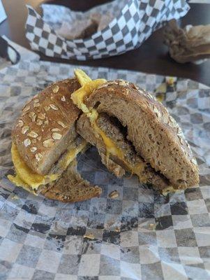 Sausage egg and cheese breakfast sandwich on multigrain bagel