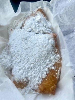 Beignets - order of 3. Shown is ONE beignet. These things are huge. You can also get an order of 9 bite sized beignets.