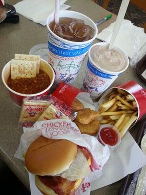 Lunch time! Sweet tea, chocolate frosty, fries, chill, nuggets and burger.