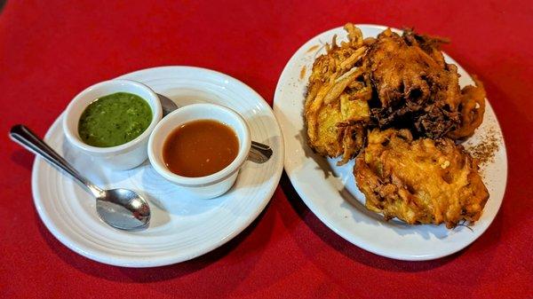 Vegetable pakoras with chutneys.