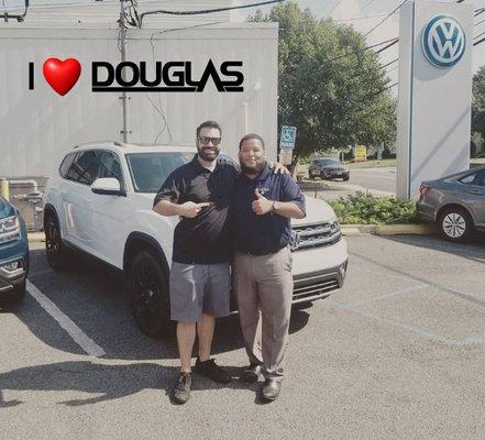 "Everybody smiles at Douglas VW!" and so will you! That`s Master VW Sales Rep Isaac Bunton making another Happy Douglas VW Customer smile!