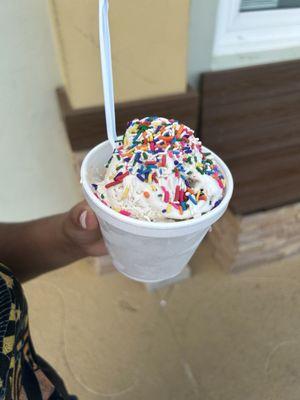 3 scoops of pecan ice cream with sprinkles.