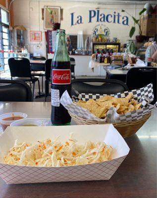 While you wait for the homemade pupusas you will get a basket of chips, Salvadoran slaw and some hot sauces