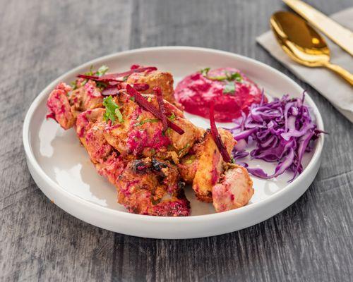 Boneless chicken marinated with beetroot, yogurt, ginger, garlic, flavorful spices cooked on grill and served with beetroot and mayonnaise s