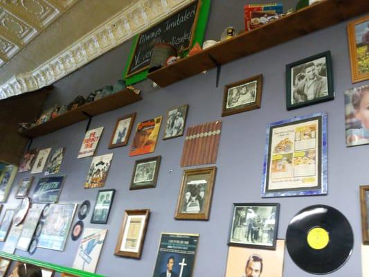 Retro album covers and print adds cover the walls