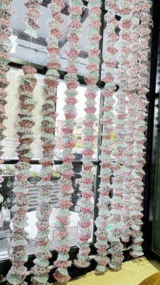 Beautiful paper cupcake ornaments by the window,