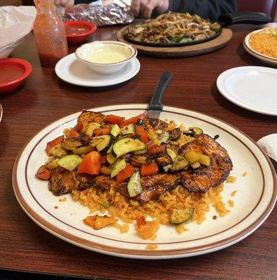 Pollo Yucatán, chess's dip and in the background, Steak Fajitas.