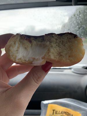 Supposed to be Boston Kreme. Half-filled and frosting. ‍