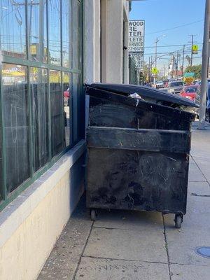 Dumpster blocking public right of way. It's left there for days at a time.