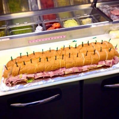 Had the owner take a picture of the 4 foot party sub he made!