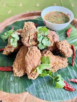 Cambodian Fried Chicken Wings. Gluten Free. Served with our garlic lime sauce.