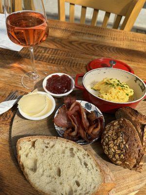 Scrambled eggs plate including butter and jam.  Ate it all!