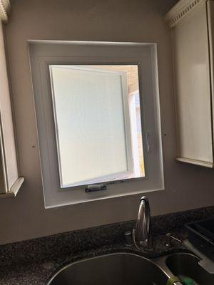 Kitchen window, pending lever cover from Milgard.