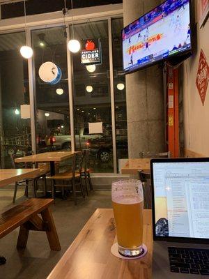 Quality beer, WiFi, table for a laptop, TVs showing sport, view of traffic. Well done.