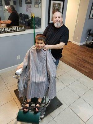 7 year old William stopping in to see Bob, his barber.