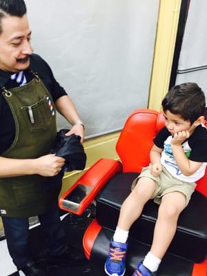 2.5 year old Santiago was a bit leery sitting in the chair, but excited as he didn't protest it either.