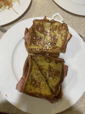 Monte Cristo... easy on the powdered sugar, thick ham and Swiss inside.... My favorite!