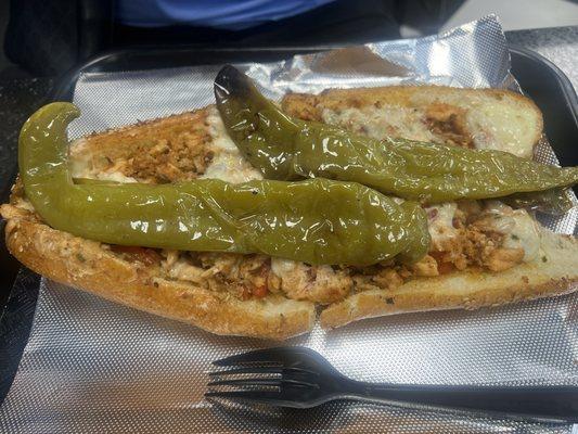 Salmon cheesesteak with long hots with sautéed onions and Italian red peppers, toasted.. so freaking delicious..