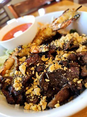 Grilled shrimp and grilled pork over vermicelli noodles with fish sauce. Tender and crunchy. Sweet and salty.