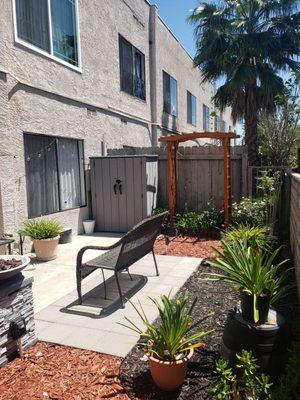 Back of building, back patio of one of the units