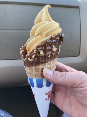 Vanilla/Chocolate twist, medium size, dipped in butterscotch, in a chocolate/peanut dipped sugar cone.