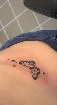 Butterfly tattoo on hip