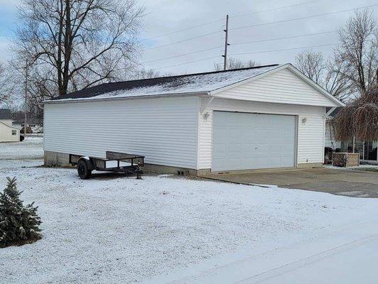 Newly roofed and sided garage.