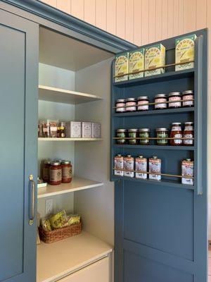 One of several stocked cupboards in the pantry