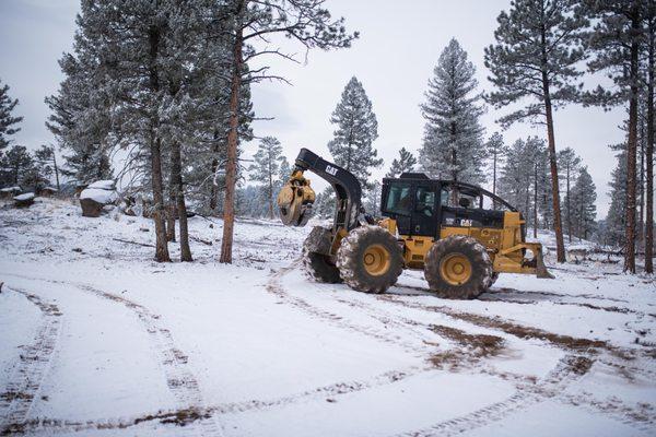 Our big Cat spreading slash around after the clearing has been done.