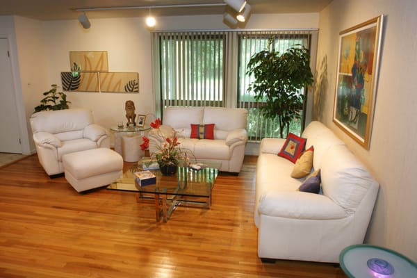 Sleek, clean lines with pops of color turned a dark, drab living room into a bright entertaining space.