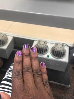 The middle finger is the only nail done right, the rest are not the shades that I picked or pattern