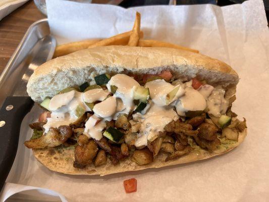 Shawarma sandwich on baguette.