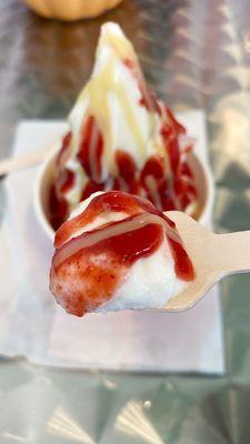 Sunrise sundae with pineapple soft serve, strawberry li hing sauce, and coconut condensed milk drizzle.