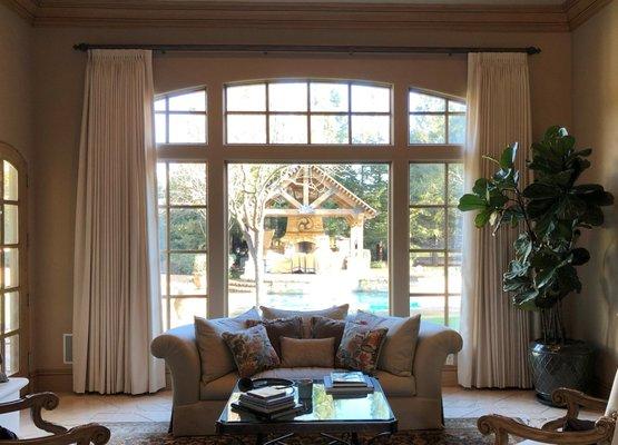 A set of beautiful cream drapes we installed in this elegant formal living room.