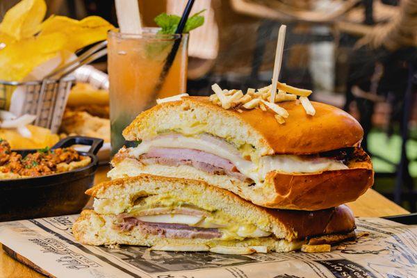 SANDWICH CUBANO/ EL GUAPO
Ham, sliced roasted pork, swiss cheese, pickles, and mustard on a pressed Cuban bread