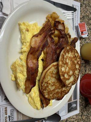 Scrambled eggs bacon sweet and crispy home fries perfectly seasoned and English muffin grilled of course YUM!