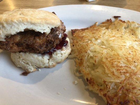 Chicken biscuit with blackberry honey butter and hash browns.