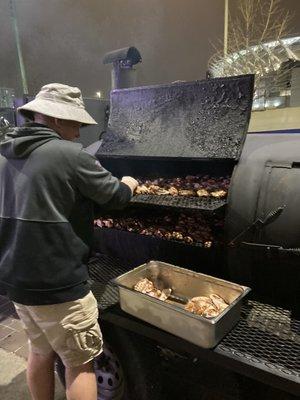 The owner Billy smoking meat everyday.