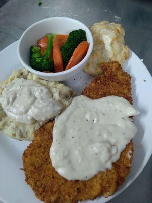 Chicken fried pork steak and mash potatoes. All home made and very good. The mash potatoes were not boxed mashed, very good.