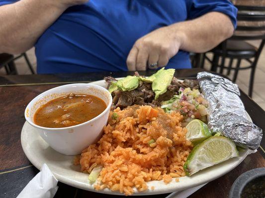 Carnitas with sides of rice, beans and tortillas