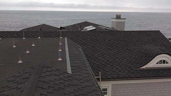 clean charcoal roof by the beach ready for panel installation.