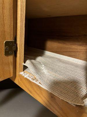 More white powder on kitchen shelf