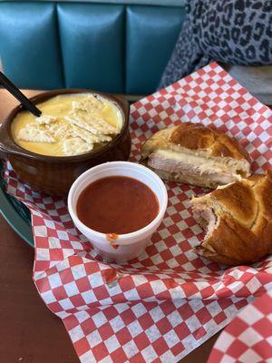 Chicken parm on pretzel bun, with cheddar broccoli soup.