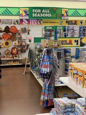 Display shelves leaning against other displays, boxes of product precariously placed on top of other things