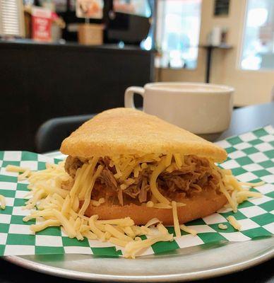 Shredded beef and gouda cheese arepa