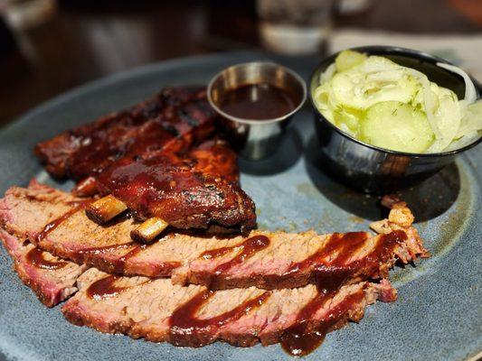 Combo plate of brisket, pork ribs and cucumber onion salad